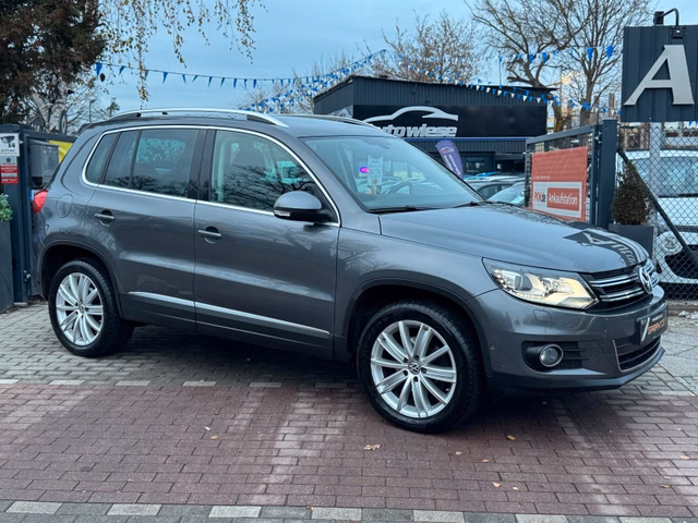 Volkswagen Tiguan Sport & Style 4Motion*Pano*Navi*Xenon*AHK - bilder 1