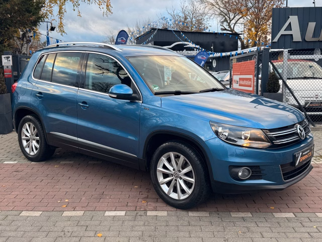 Volkswagen Tiguan Lounge 1.4 TSI Aut*Nav*1.Hd*AHK*TÜV NEU* - bilder 1